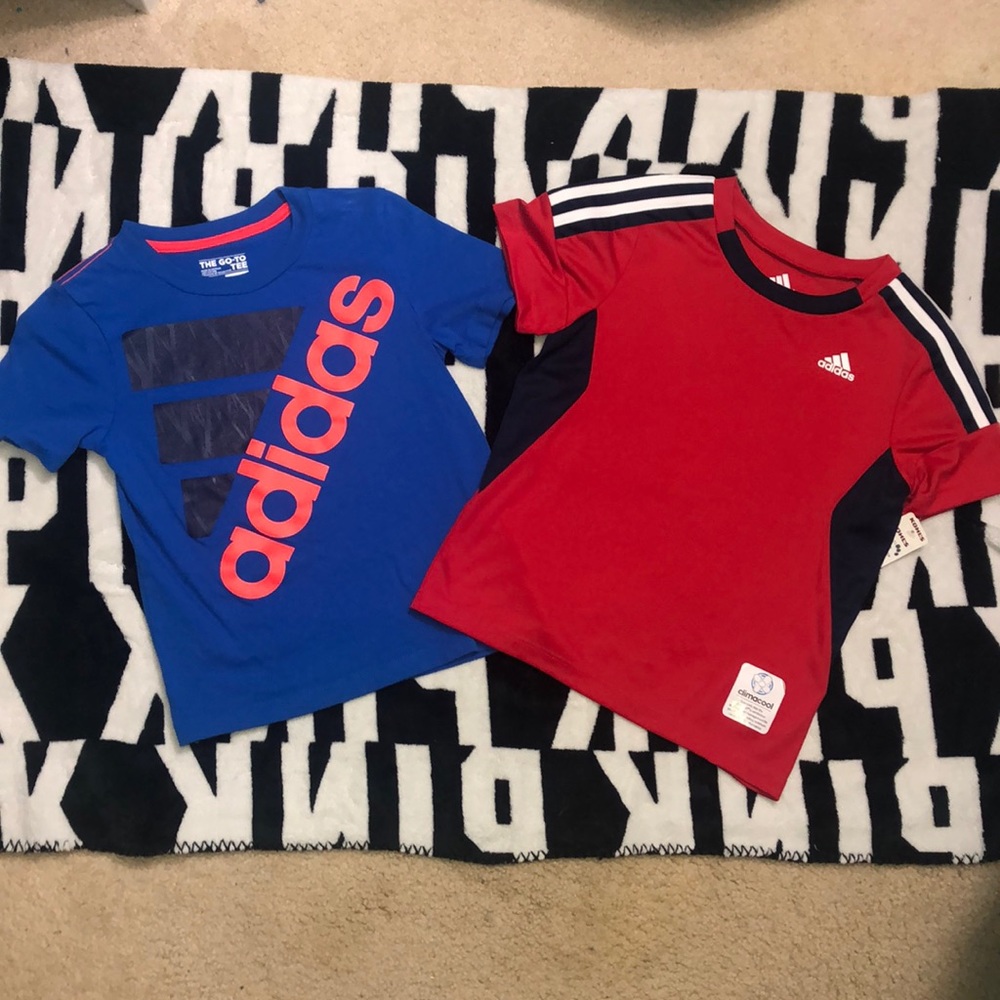 Two boys Adidas T-shirts.